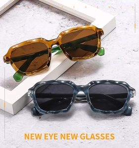 Detail of colorful wavy square sunglasses with stylish irregular frame texture