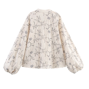 Beige floral embroidered V-neck blouse with lantern sleeves and textured linen-like fabric
