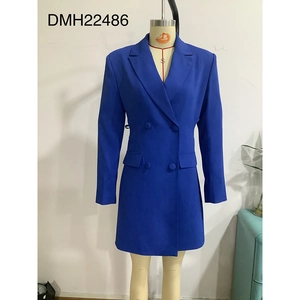 Detail of double-breasted royal blue blazer dress with notched collar and waist pockets
