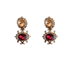 Vintage palace style earrings with amber and red gemstones on white background