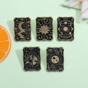 Punk style tarot card enamel pins set featuring black and gold moon and sun patterns