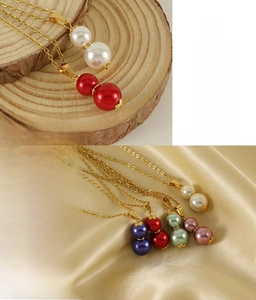 Detail of 18k gold-plated stainless steel gourd pendant necklace with colorful pearls