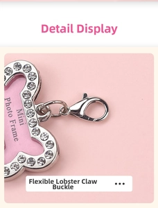 Macro detail of heart-shaped rhinestone photo frame with flexible metal lobster clasp