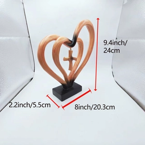 Detailed view of the brown heart cross resin ornament with size measurements shown