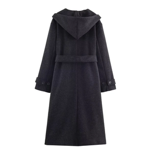 Rear view of long hooded wool coat featuring waist belt and back vent detail