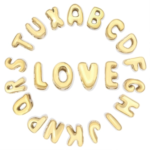 Golden 3D letters spelling LOVE in a circular arrangement of bead accessories