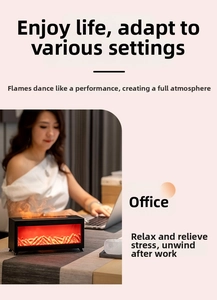 Detail view of black desktop flame humidifier with orange LED fire mist effect for office