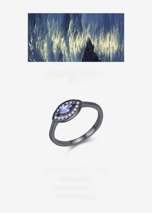 Macro shot of S925 silver vintage ring with marquise blue stone and tiny white diamonds