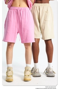Detail of cotton sweat shorts showing elastic drawstring waist and knit texture