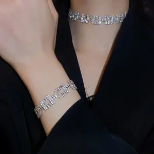 Luxury geometric square link jewelry set with sparkling crystals on model