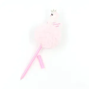Close-up of pink swan pom-pom pen with golden crown detail and fluffy faux fur texture