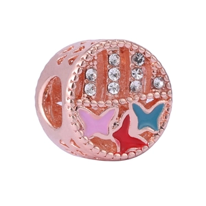 Detailed view of rose gold charm with clear rhinestones and colorful enamel butterflies