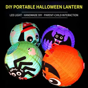 DIY Halloween paper lanterns with LED lights featuring ghost and spider patterns