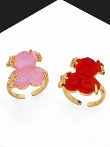 Detail view of colorful gummy bear rings with gold plating and star-shaped zircon accents
