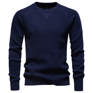 Close-up of premium navy blue knit texture and crew neckline with size S label