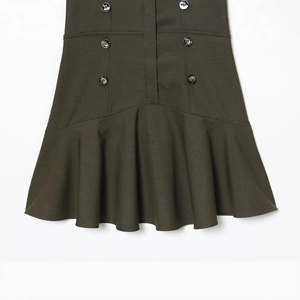 Deep green double-breasted fishtail dress with elegant buttons and structured fabric