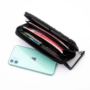 Long skull wallet with LIFE print and zipper, showing large capacity for cards and phone