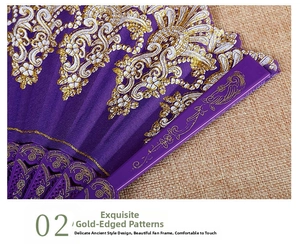 Detailed macro view of purple folding fan with golden lace embroidery and bird patterns
