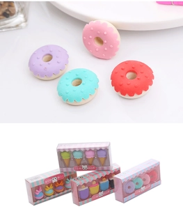 Macro detail of cartoon dessert erasers including donuts and ice cream in gift packaging
