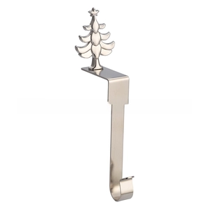 Detailed view of a silver Christmas tree fireplace mantle stocking hook holder