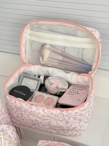 Pink floral corduroy makeup bag with quilted peony pattern and spacious zipper interior
