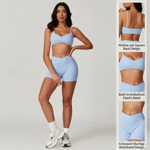 Women's light blue yoga set with V-neck camisole and crossover high waist gym shorts