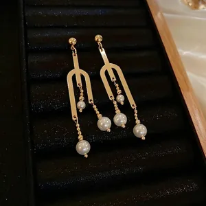 Elegant gold-plated fork pearl tassel earrings with minimalist dangling metal chains