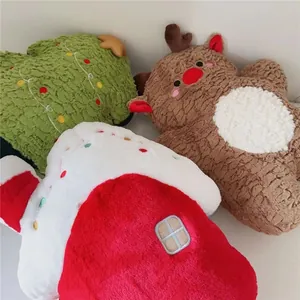 Macro detail of plush Christmas tree, reindeer, and house pillows in soft velvet fabric