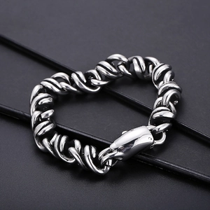 Macro view of vintage titanium steel woven bracelet with heavy-duty metal buckle lock
