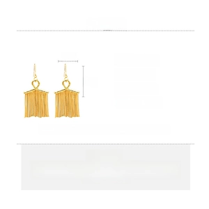 Detailed product specs of gold long tassel earrings showing copper material and 7cm size