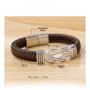Detail of handmade leather braided bracelet with infinity knot and magnetic steel clasp