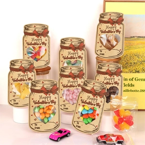 Valentine's Day mason jar candy bags with heart windows and red bows on kraft paper