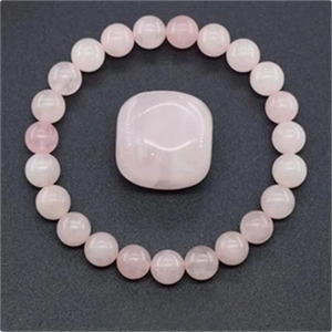 Pink strawberry crystal beaded bracelet with polished rose quartz stone centerpiece