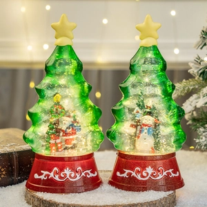 LED lighted Christmas tree snow globe with Santa and Snowman in a red base