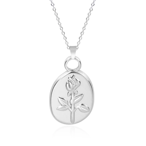 Detailed macro view of an oval pendant featuring an intricate rose flower relief carving
