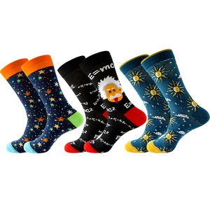 Three pairs of fun crew socks with colorful stars, Einstein E=mc² and sun motifs
