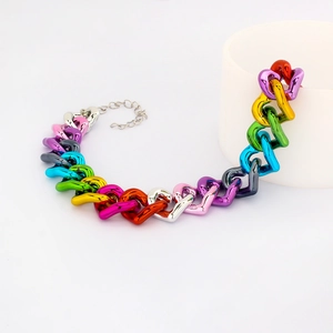 Close-up of colorful metal link pet necklace with silver extension chain and lobster clasp