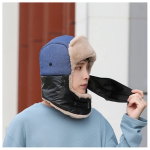 Detail of winter trapper hat with thick faux fur lining and integrated neck warmer