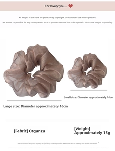 Detail view of champagne organza scrunchies in 16cm and 10cm sizes with metallic luster