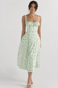 Detail of floral spaghetti strap midi dress with green botanical print and corset bodice