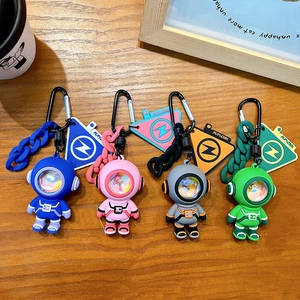 Trendy astronaut keychains with ambient light in four vibrant colors