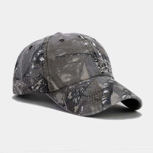 Detail of forest camouflage baseball cap with durable twill fabric and reinforced brim