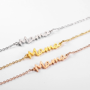Detailed view of Mama letter necklaces in gold, silver and rose gold finishes