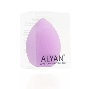 Macro shot of a purple teardrop beauty sponge inside a transparent plastic branded case