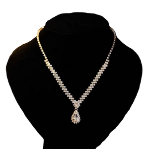 Elegant silver V-shaped rhinestone necklace set with waterdrop pendant for evening wear
