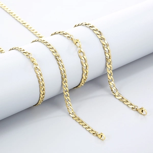 Macro view of gold plated stainless steel curb chain with secure lobster clasp