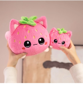 Close-up of strawberry cat plush toys in two sizes with soft pink fabric and embroidery