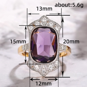 Vintage gold ring with large rectangular purple gemstone and white zircon accents