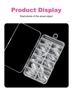 Macro shot of 120 pieces clear almond nail tips in a 10-grid plastic storage box