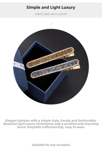 Close-up of elegant metal hairpins with shimmering rhinestones in gold and blue finish